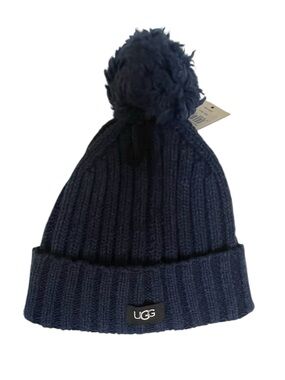 UGG knit pompom beanie NWT in Navy features a classic ribbed texture